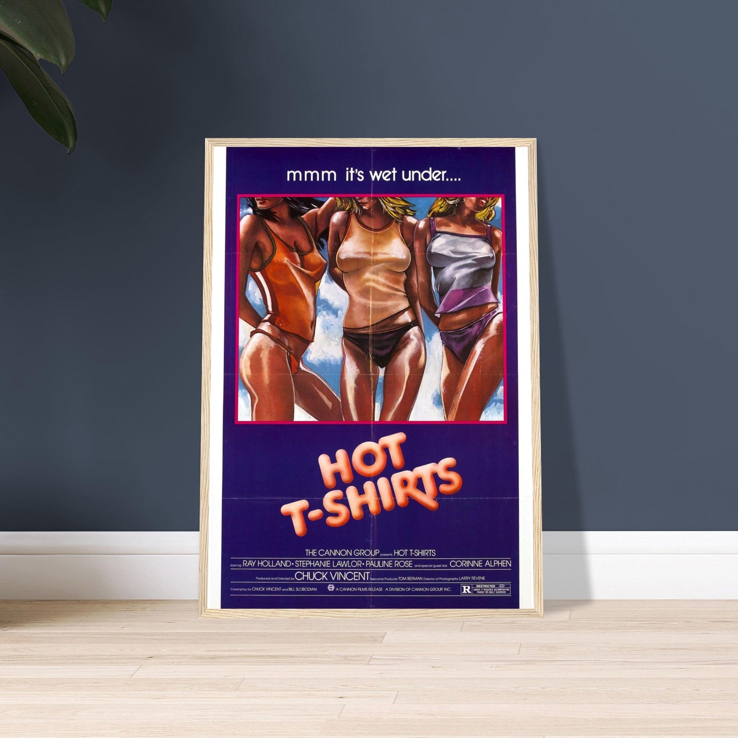 Framed retro movie poster for 'Hot T-Shirts' featuring vibrant 80s style artwork and playful typography.